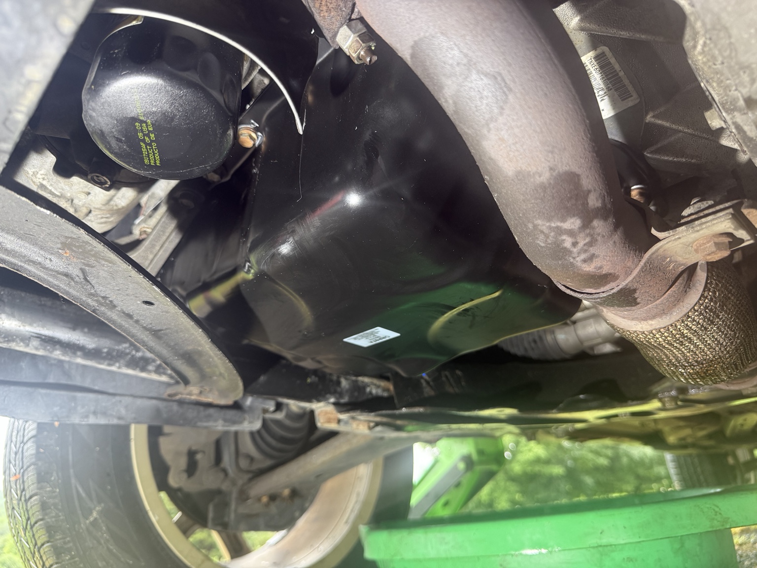 Fresh engine oil pan installed during an on-site repair